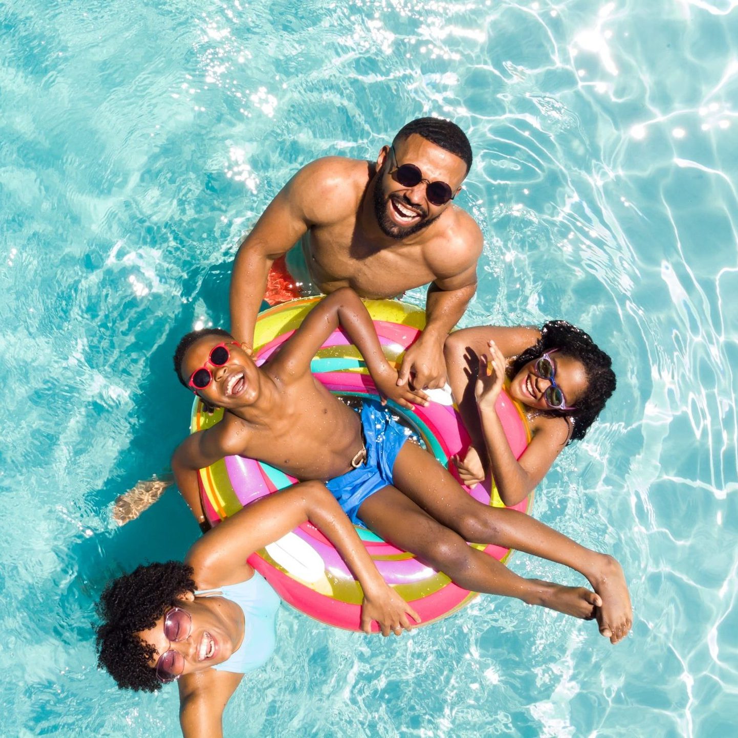 Family in a community swimming pool