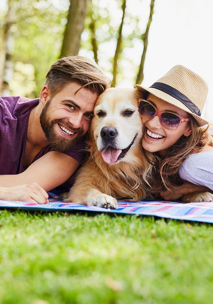 Couple and dog having a picnic